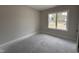 A bedroom with a large window that offers a view of the outdoors at 104 Roma Gora Ct, Princeton, NC 27569