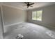Sunlit bedroom with a large window and neutral color palette at 104 Roma Gora Ct, Princeton, NC 27569