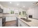 Gourmet kitchen with island sink, stainless appliances, white cabinetry, and granite countertops at 104 Roma Gora Ct, Princeton, NC 27569