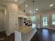 Bright kitchen with granite counters, stainless appliances, and modern fixtures at 104 Roma Gora Ct, Princeton, NC 27569