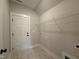 Bright laundry room features practical wire shelving and easy access with a door at 104 Roma Gora Ct, Princeton, NC 27569