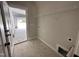 A bright laundry room with tile floors and access to garage at 104 Roma Gora Ct, Princeton, NC 27569