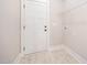The laundry room has a tile floor, shelving, and access to the outside at 104 Roma Gora Ct, Princeton, NC 27569