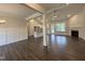 Open-concept living area featuring hardwood floors, a fireplace, and plenty of natural light at 104 Roma Gora Ct, Princeton, NC 27569