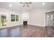 Bright living room showcasing hardwood floors, a fireplace, and a sliding glass door at 104 Roma Gora Ct, Princeton, NC 27569