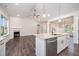 Open concept kitchen and living room area with stainless dishwasher at 104 Roma Gora Ct, Princeton, NC 27569
