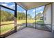 Relaxing screened-in porch with views of the wooded backyard at 104 Roma Gora Ct, Princeton, NC 27569