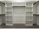 Spacious walk-in closet features custom shelving for optimal storage solutions at 104 Roma Gora Ct, Princeton, NC 27569