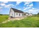 A new home with a covered patio overlooking a spacious lawn at 105 Tuskeegee Dr, Smithfield, NC 27577