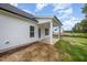 The backyard with covered patio extending from the rear of the house at 105 Tuskeegee Dr, Smithfield, NC 27577