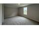 Bedroom with neutral carpet and a window providing natural light at 105 Tuskeegee Dr, Smithfield, NC 27577