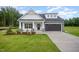 Beautiful two-story home featuring a well-maintained lawn, a garage, and an inviting entrance at 105 Tuskeegee Dr, Smithfield, NC 27577