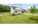 Attractive home with a well-kept lawn, stone accents, and a convenient garage at 105 Tuskeegee Dr, Smithfield, NC 27577