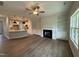 Spacious living room featuring a modern fireplace, open to an eat-in kitchen island and stainless steel appliances at 105 Tuskeegee Dr, Smithfield, NC 27577