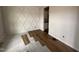 Room with diamond accent wall and wood flooring being installed at 105 Tuskeegee Dr, Smithfield, NC 27577