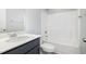 Well-lit bathroom with a single sink vanity and a shower-tub combo at 106 Burnello Ct, Princeton, NC 27569