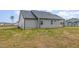 Side view of home with light gray vinyl siding and covered patio at 106 Burnello Ct, Princeton, NC 27569