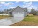 Charming single story home with gray siding, stone accents, and a two car garage at 106 Burnello Ct, Princeton, NC 27569