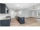 Kitchen with granite countertops and stainless steel appliances overlooks the open living area at 106 Burnello Ct, Princeton, NC 27569