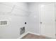 Laundry room includes washer/dryer hookups and storage shelving for convenience and functionality at 106 Burnello Ct, Princeton, NC 27569