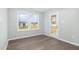 Well-lit open living area with luxury vinyl plank flooring with views to the exterior at 106 Burnello Ct, Princeton, NC 27569