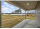 Covered back patio featuring a concrete floor and green backyard at 106 Burnello Ct, Princeton, NC 27569