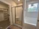 Bathroom with walk in shower, soaking tub, and window for natural light at 106 Roma Gora Ct, Princeton, NC 27569