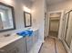 Bathroom featuring double vanity, walk in shower, and walk-in closet at 106 Roma Gora Ct, Princeton, NC 27569