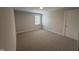 This bedroom has neutral walls and carpet flooring and lots of natural light from the window at 106 Roma Gora Ct, Princeton, NC 27569
