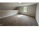 A cozy bedroom with neutral colored carpet, neutral paint and natural light coming through the window at 106 Roma Gora Ct, Princeton, NC 27569