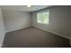 Bedroom featuring neutral carpet, bright natural light, and neutral walls at 106 Roma Gora Ct, Princeton, NC 27569