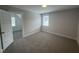 This bedroom has neutral walls, carpet flooring, natural light and a closet for storage space at 106 Roma Gora Ct, Princeton, NC 27569