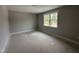 Bedroom featuring a window and neutral wall paint at 106 Roma Gora Ct, Princeton, NC 27569