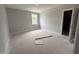 Unfinished bedroom with a window, white trim, and open closet door, ready for your customization at 106 Roma Gora Ct, Princeton, NC 27569
