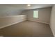 Bright bonus room with natural light and neutral carpet flooring at 106 Roma Gora Ct, Princeton, NC 27569