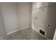 Unfinished closet with geometric tile flooring and a wire rack, offering simple storage solutions at 106 Roma Gora Ct, Princeton, NC 27569