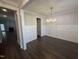 Spacious dining room features elegant wainscoting, dark wood floors, and a modern chandelier at 106 Roma Gora Ct, Princeton, NC 27569