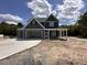 Beautiful two-story home featuring a three-car garage and a welcoming front porch at 106 Roma Gora Ct, Princeton, NC 27569