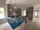 Kitchen with gray cabinets, a tile backsplash, and a center island at 106 Roma Gora Ct, Princeton, NC 27569