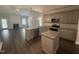 Open kitchen with granite countertops, stainless steel appliances, and an adjacent living area at 106 Roma Gora Ct, Princeton, NC 27569