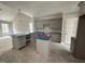 Kitchen featuring gray cabinets, kitchen island, and pendant lighting at 106 Roma Gora Ct, Princeton, NC 27569