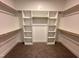 Walk-in closet with shelving for optimized organization and storage at 106 Roma Gora Ct, Princeton, NC 27569