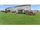 Spacious backyard featuring lush green grass and a charming screened porch at 108 E Fountainhead Ln, Garner, NC 27529
