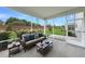 Relaxing screened patio with comfortable seating and scenic backyard views, perfect for outdoor entertaining at 108 E Fountainhead Ln, Garner, NC 27529