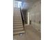 Foyer under construction featuring a stairway, walls with paneling, and doorway at 1116 Kimberly Dr, Raleigh, NC 27609