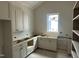 New kitchen with custom white cabinets and stainless steel appliances at 1116 Kimberly Dr, Raleigh, NC 27609