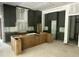 New kitchen with modern dark cabinets, a kitchen island and stainless steel appliances at 1116 Kimberly Dr, Raleigh, NC 27609