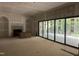 Spacious living room with fireplace and sliding doors, ready for customization at 1116 Kimberly Dr, Raleigh, NC 27609