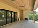 This beautiful covered patio has slate floors and a brick fireplace for cozy outdoor gatherings and relaxation at 1116 Kimberly Dr, Raleigh, NC 27609