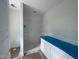 Clean bathroom with new vanity, shower and tub combo, and ample storage at 112 Remington Woods Dr, Wake Forest, NC 27587